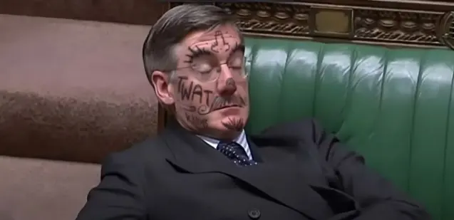 Mogg is face painted while snoozing in the Commons