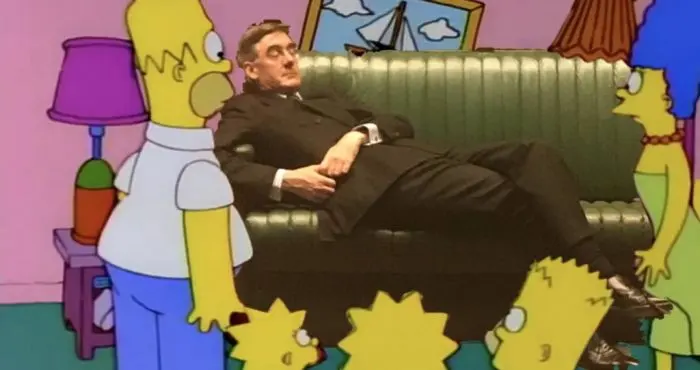 Homer and family look questioningly at Mogg on the couch